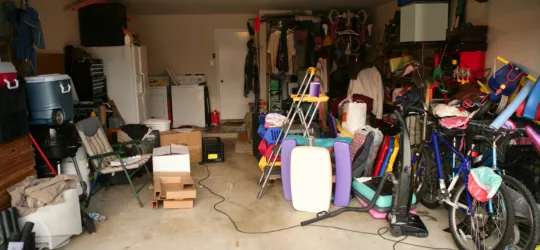 cluttered garage in need of a cleanout