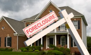 A house with a foreclosure sign- Junk-A-Haulics